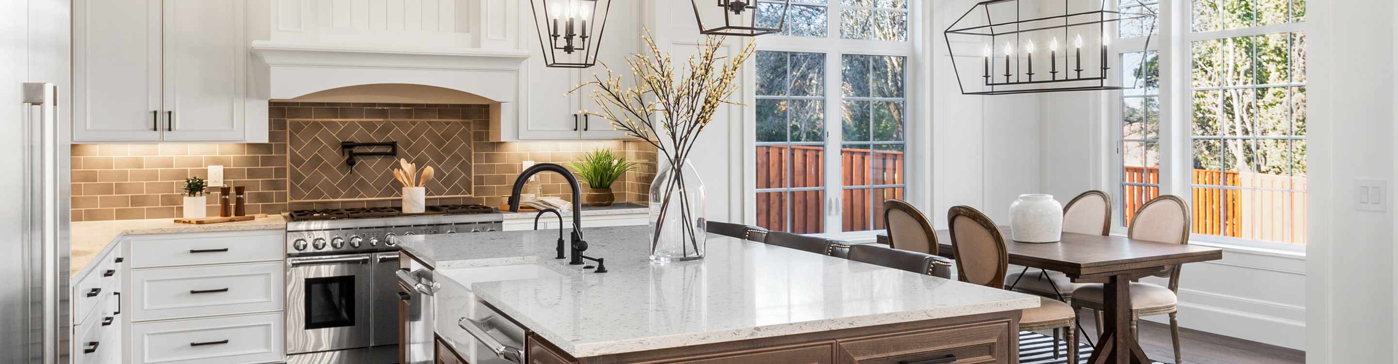 tile backsplash in a kitchen with wood floors