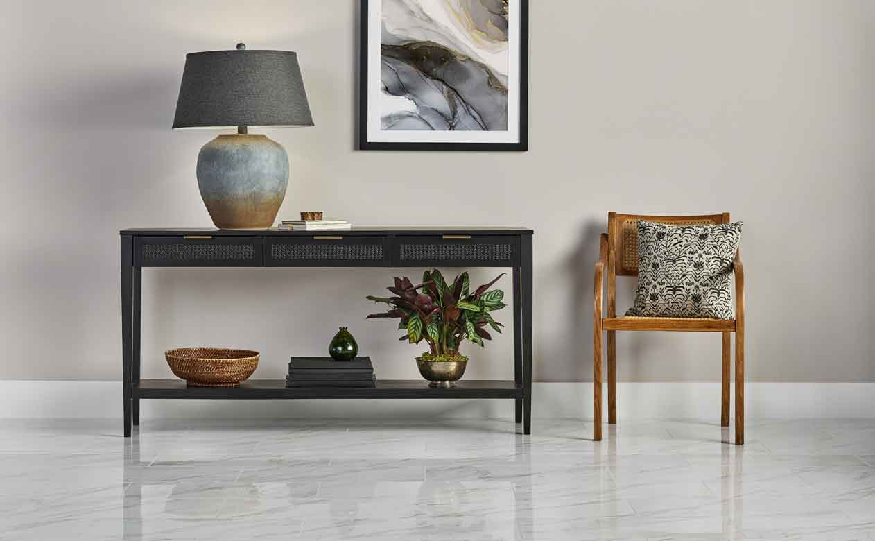 Living room with Woven Drawer Console Table Black and marble look tile flooring