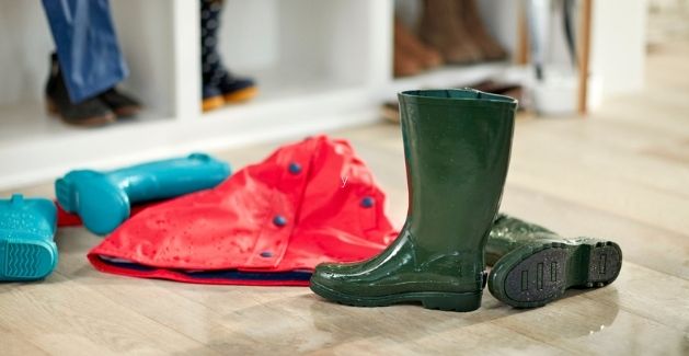 wet boots and rain gear on waterproof hardwood floors